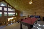 Open Loft with a Pool Table and a Day Bed 